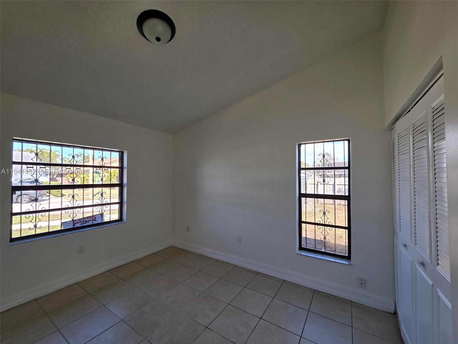 15238 Southwest 58th Terrace Miami, FL 33193 - Photo 21 of 38 an empty room with windows