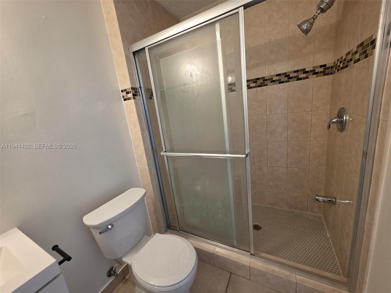 15238 Southwest 58th Terrace Miami, FL 33193 - Photo 24 of 38 a white toilet sitting next to a shower