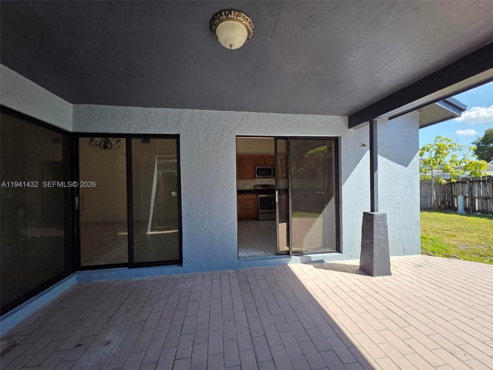 15238 Southwest 58th Terrace Miami, FL 33193 - Photo 25 of 38 an empty room with wooden floor and windows