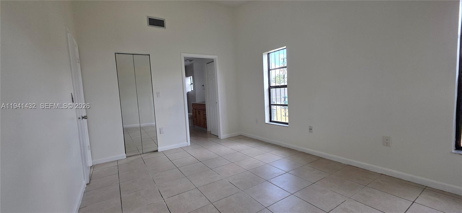15238 Southwest 58th Terrace Miami, FL 33193 - Photo 26 of 46 an empty room with windows and closet
