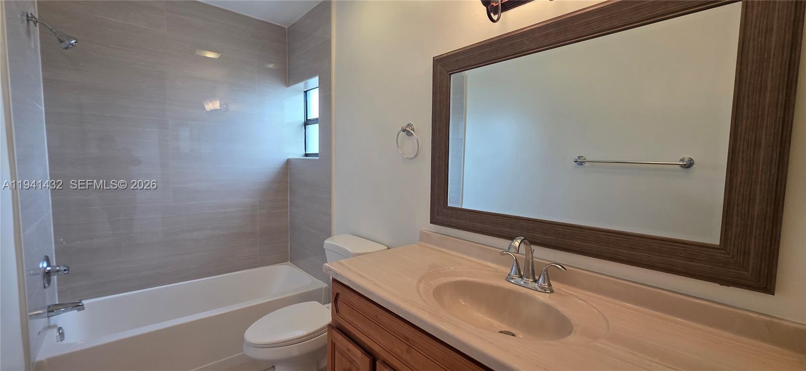 15238 Southwest 58th Terrace Miami, FL 33193 - Photo 32 of 46 a bathroom with a sink toilet and shower