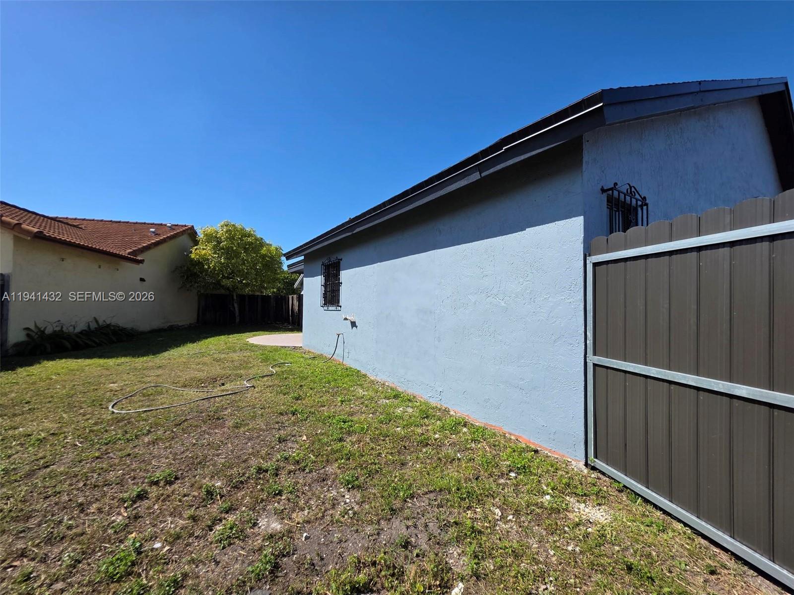 15238 Southwest 58th Terrace Miami, FL 33193 - Photo 33 of 38 a backyard of a house