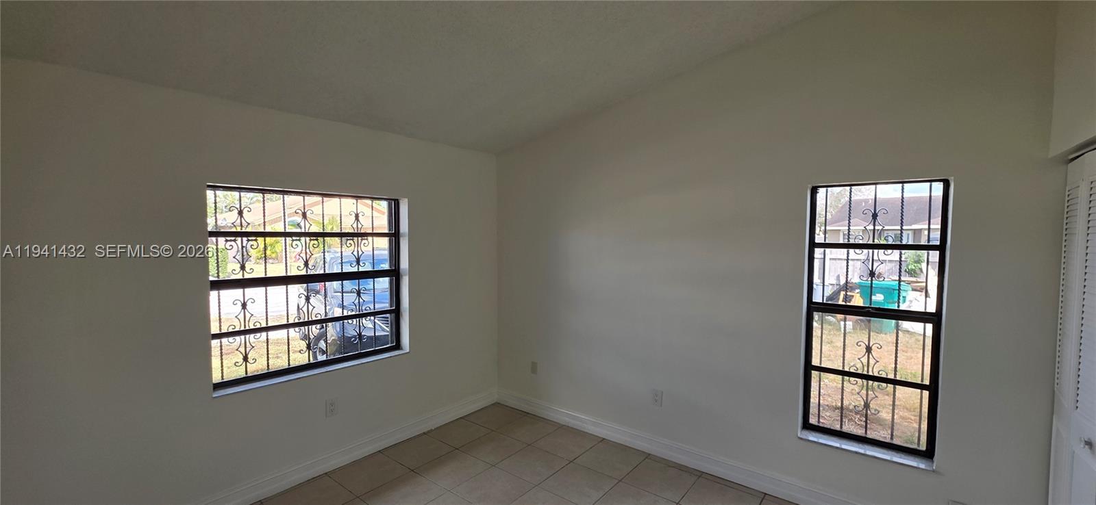 15238 Southwest 58th Terrace Miami, FL 33193 - Photo 37 of 46 an empty room with windows and closet