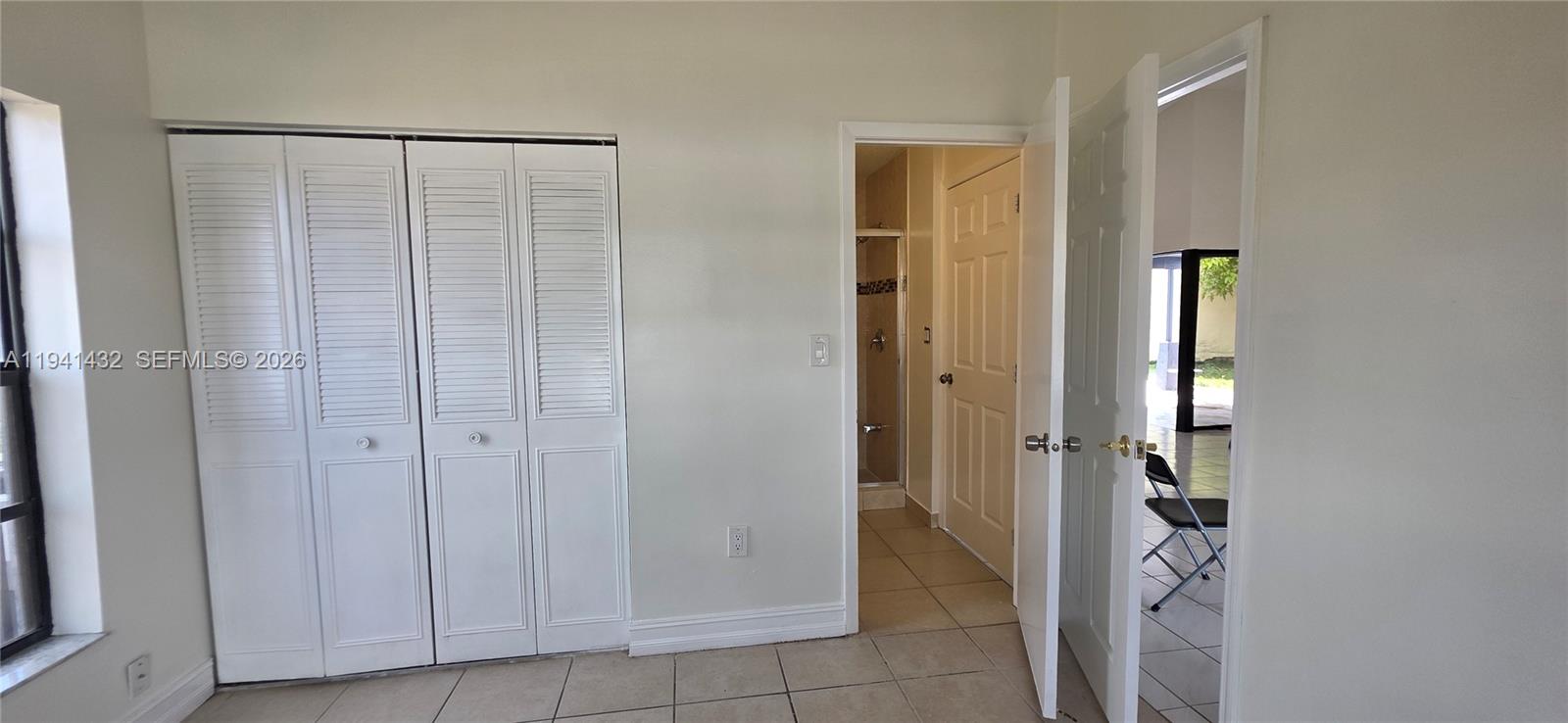 15238 Southwest 58th Terrace Miami, FL 33193 - Photo 41 of 46 an entryway with a glass door