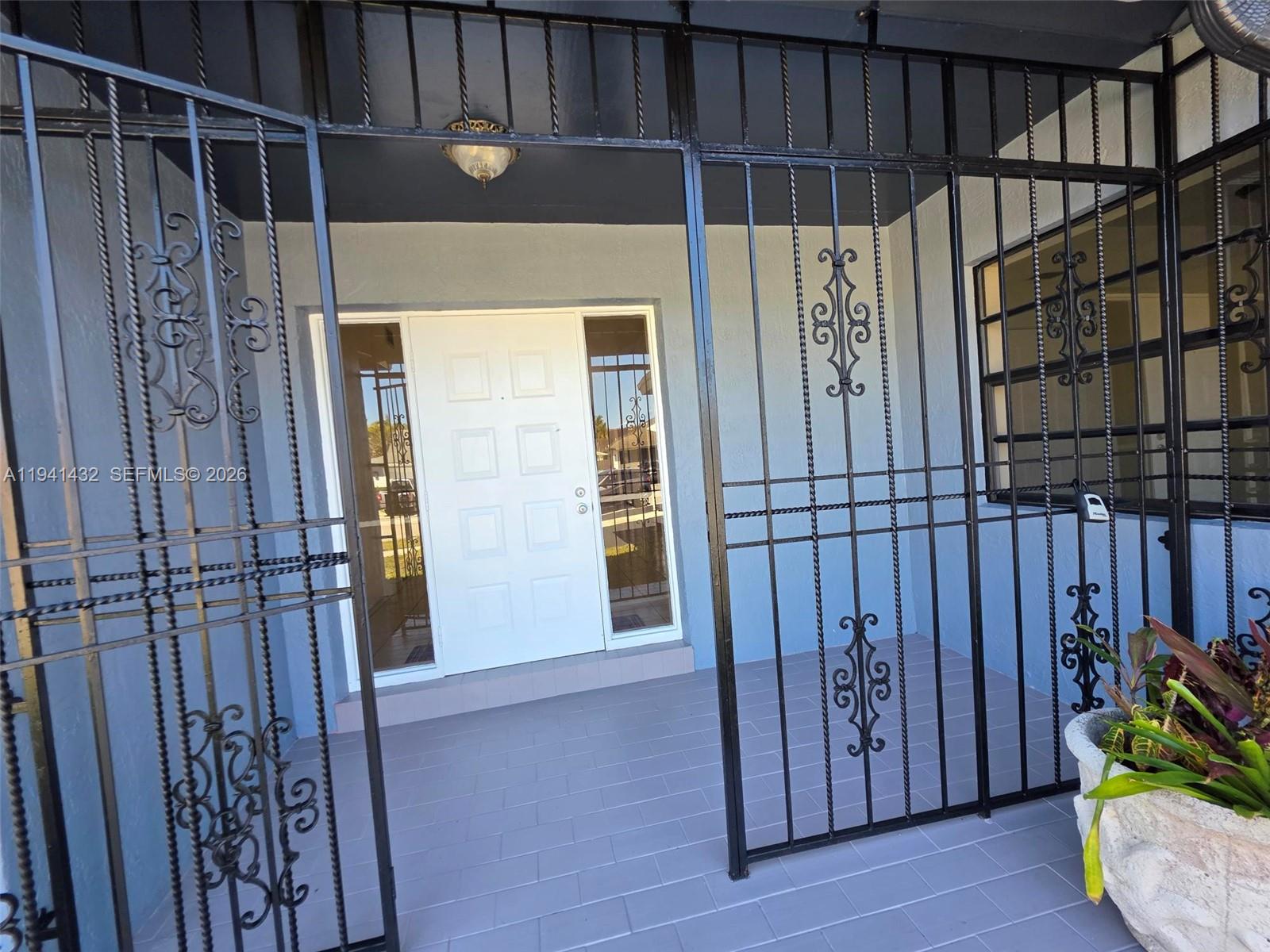 15238 Southwest 58th Terrace Miami, FL 33193 - Photo 6 of 38 a view of an entryway with wooden floor