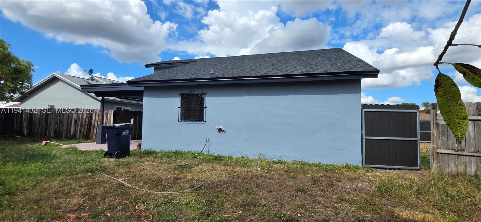 15238 Southwest 58th Terrace Miami, FL 33193 - Photo 6 of 46 a front view of a house with garden