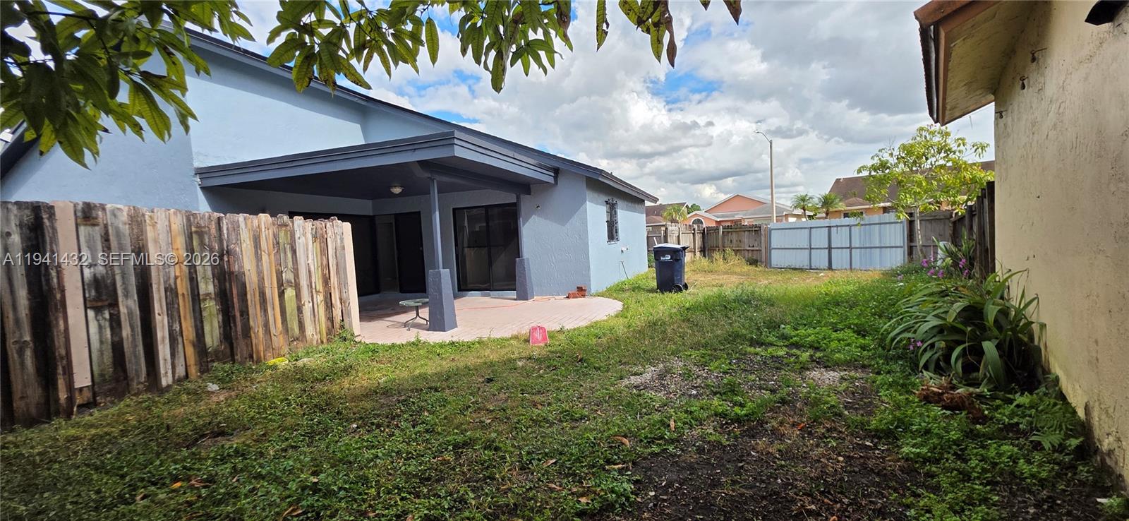 15238 Southwest 58th Terrace Miami, FL 33193 - Photo 9 of 46 a view of a house with a small yard and plants