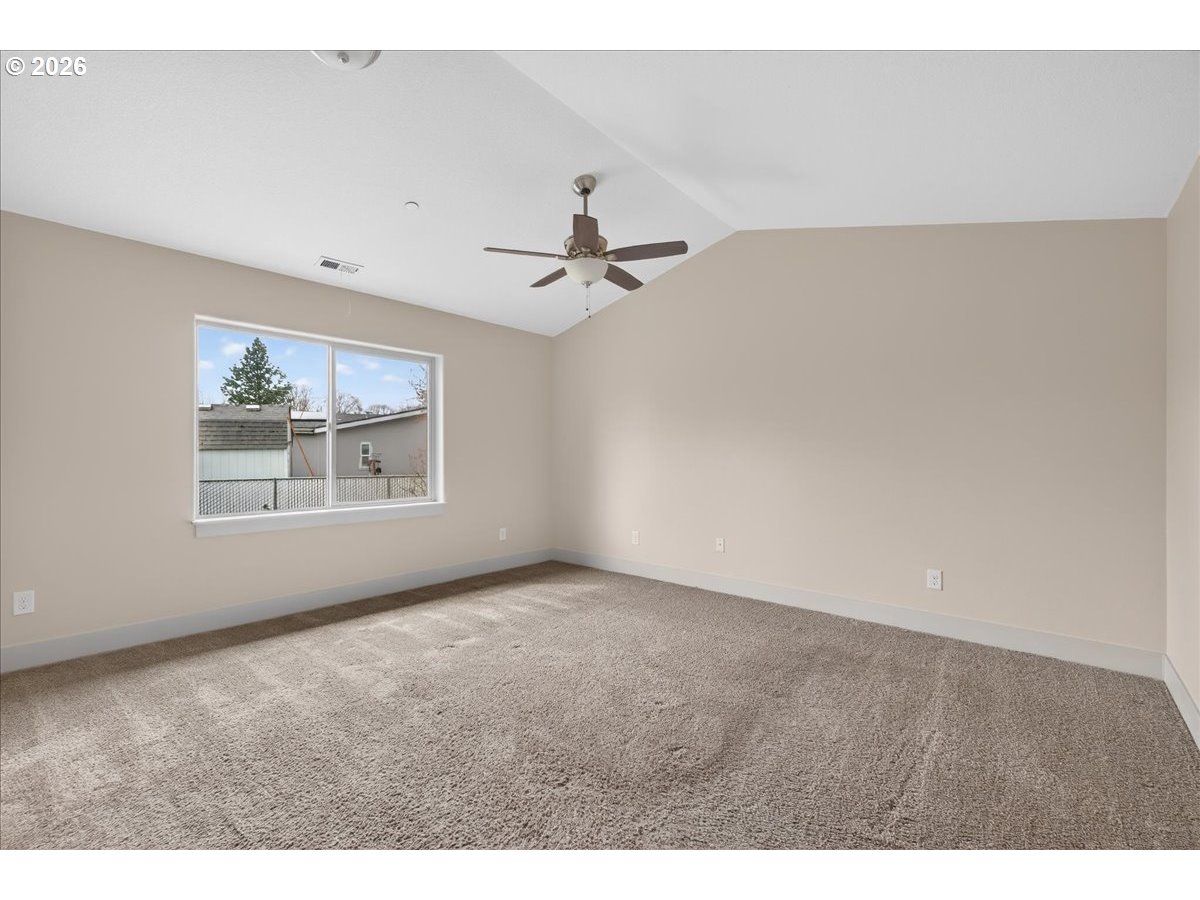 561 North Declaration Drive Carlton, OR 97111 - Photo 30 of 44 an empty room with windows and ceiling fan