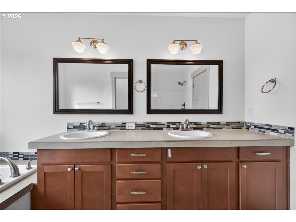 561 North Declaration Drive Carlton, OR 97111 - Photo 34 of 44 a bathroom with a double vanity sink and a mirror
