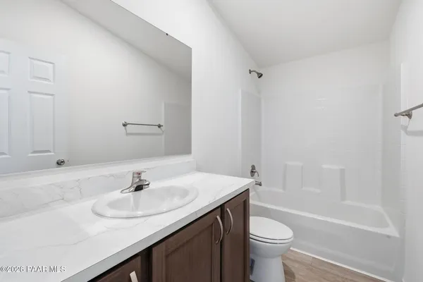 a bathroom with a sink toilet and a bathtub