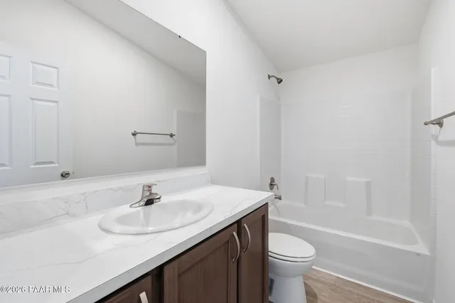 a bathroom with a sink toilet and a bathtub