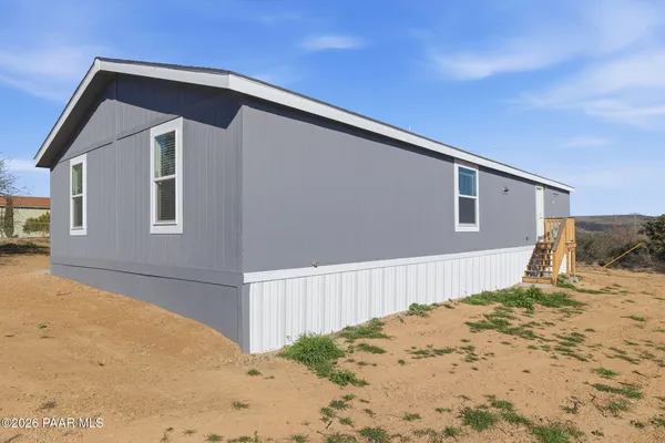 a spacious bathroom with a toilet tub and shower