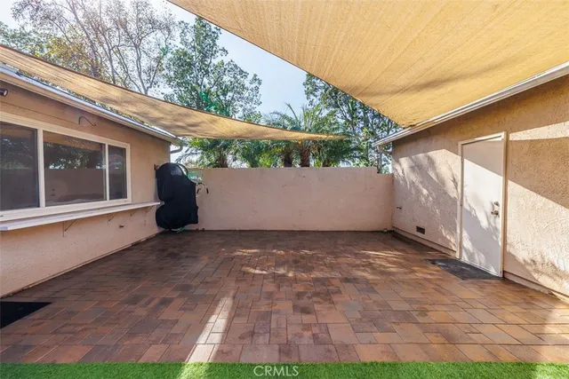 a view of yard with patio