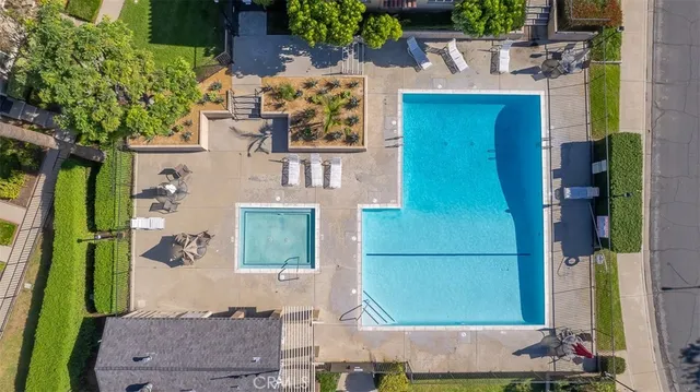 aerial view of a house with a backyard
