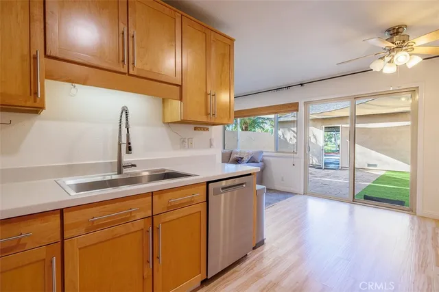 a kitchen with a sink and cabinets