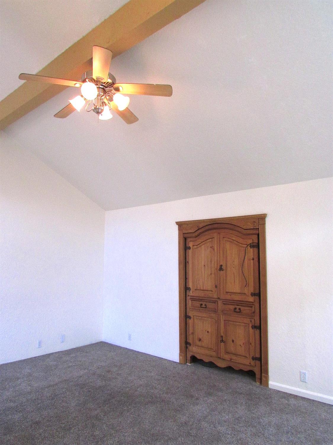 1855 Scenic Drive, Unit F Modesto, CA 95355 - Photo 12 of 52 a view of a livingroom with a chandelier fan