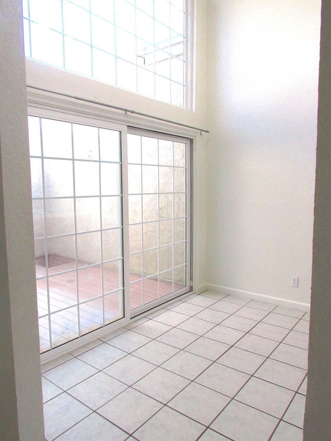 1855 Scenic Drive, Unit F Modesto, CA 95355 - Photo 16 of 52 a view of empty room with window