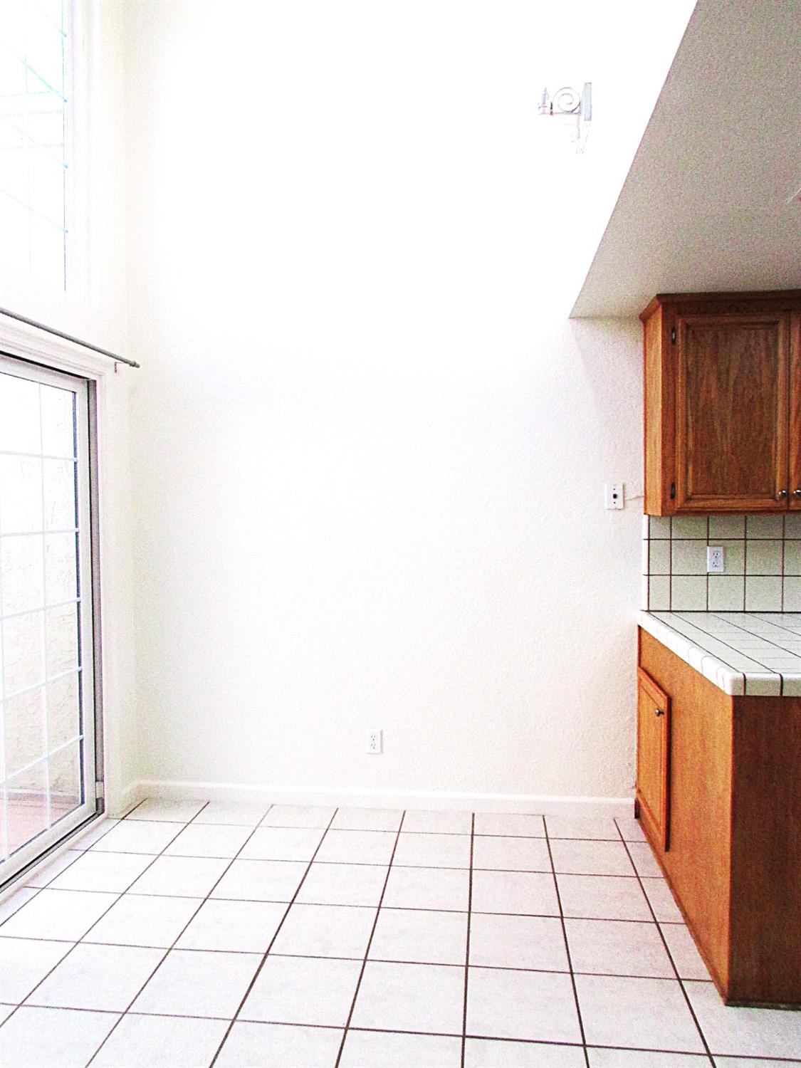 1855 Scenic Drive, Unit F Modesto, CA 95355 - Photo 17 of 52 a view of a kitchen with a sink