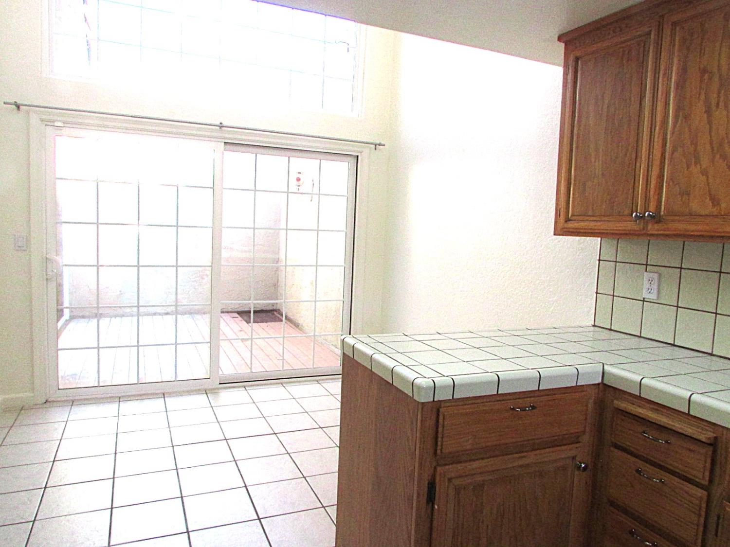 1855 Scenic Drive, Unit F Modesto, CA 95355 - Photo 18 of 52 a view of a kitchen with a sink
