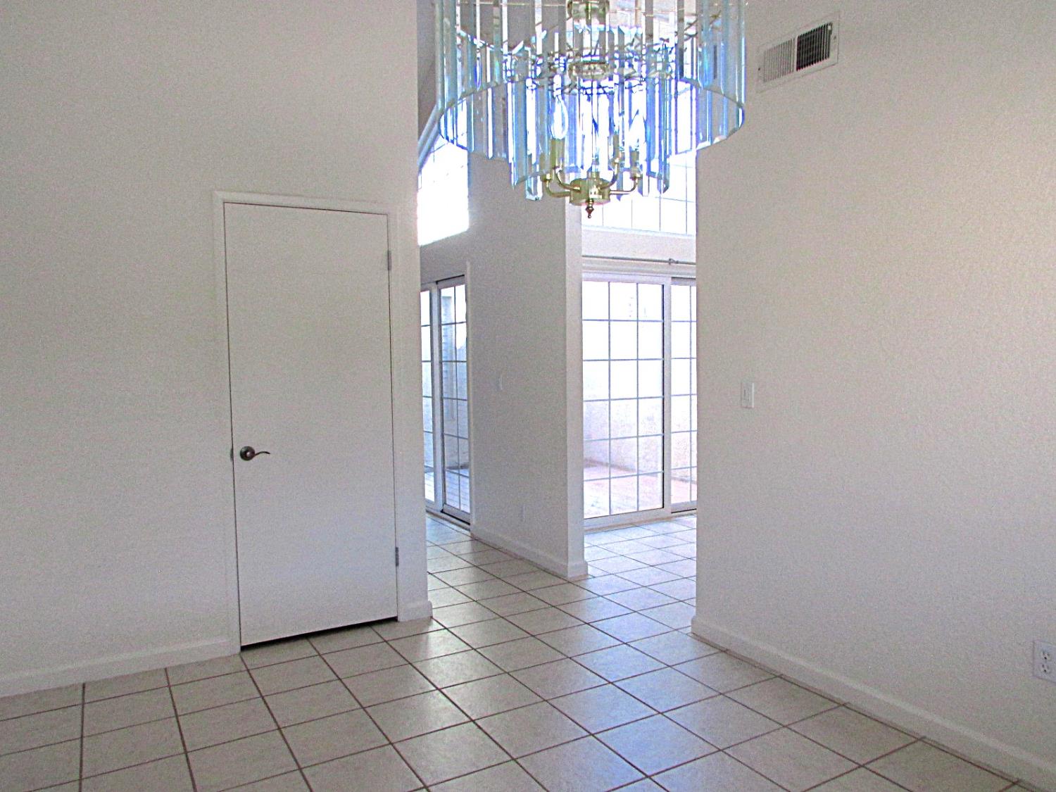1855 Scenic Drive, Unit F Modesto, CA 95355 - Photo 26 of 52 a view of entryway with chandelier