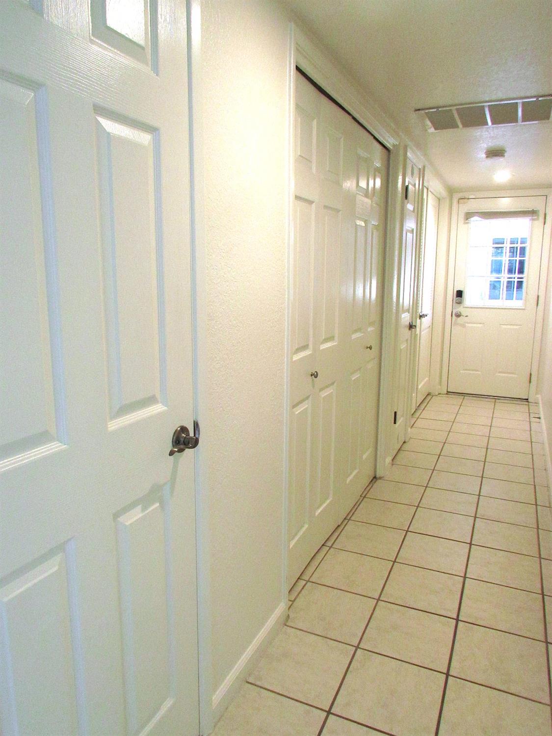 1855 Scenic Drive, Unit F Modesto, CA 95355 - Photo 29 of 52 a bathroom with a glass shower door and a bathtub