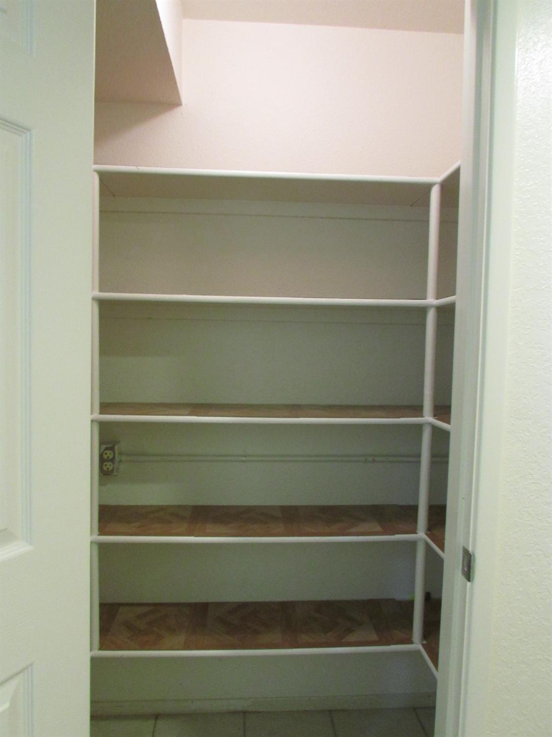 1855 Scenic Drive, Unit F Modesto, CA 95355 - Photo 30 of 52 a view of walk in closet with empty racks
