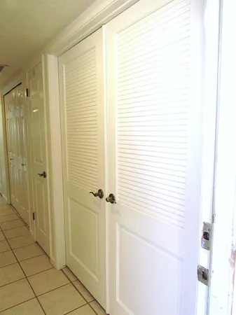 wooden floor in an empty room with a mirror