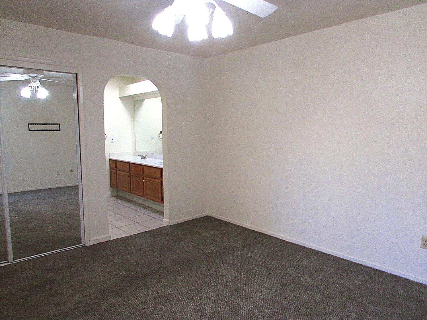 1855 Scenic Drive, Unit F Modesto, CA 95355 - Photo 40 of 52 wooden floor in an empty room