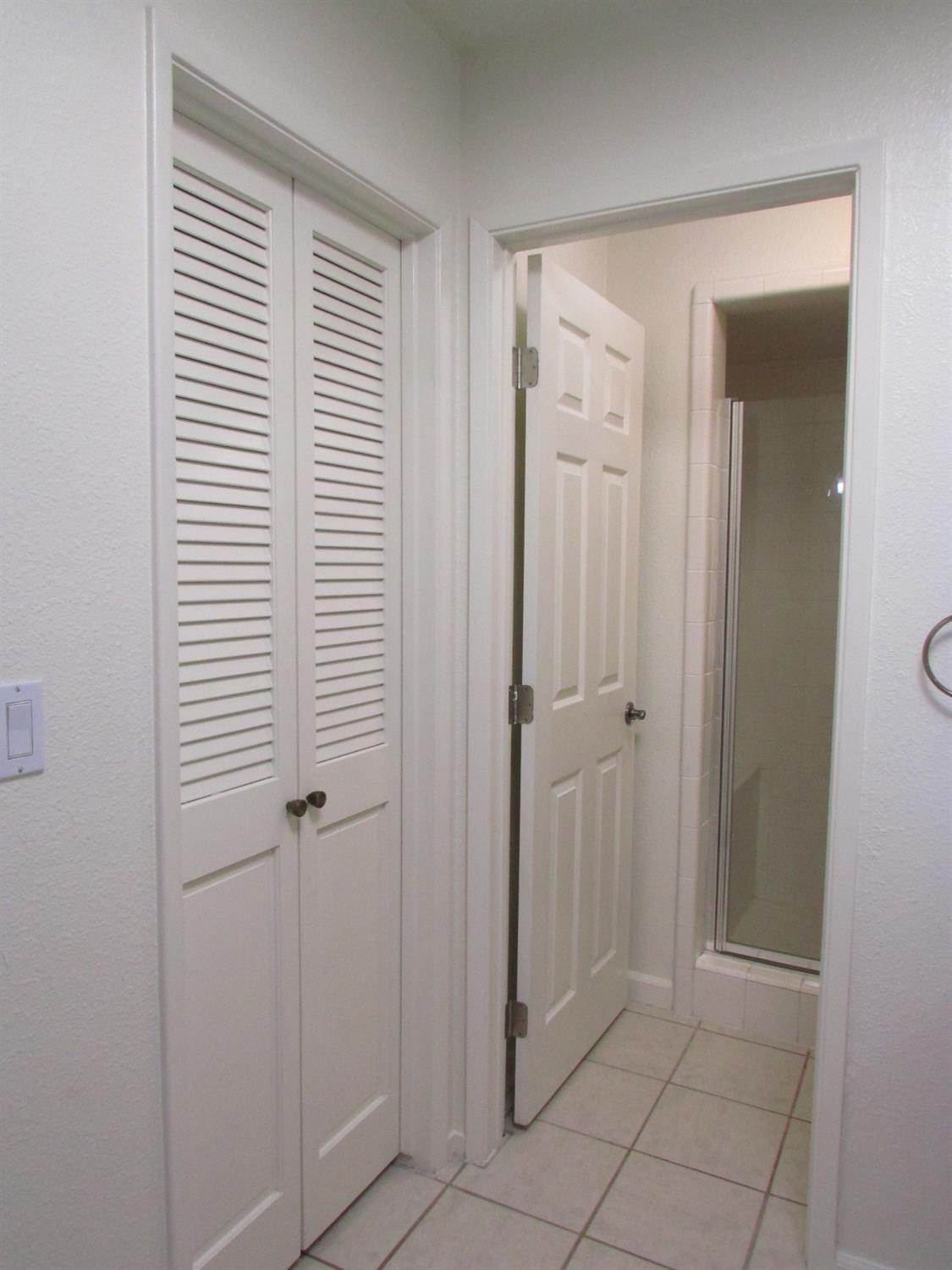 1855 Scenic Drive, Unit F Modesto, CA 95355 - Photo 43 of 52 a view of a bathroom with a shower