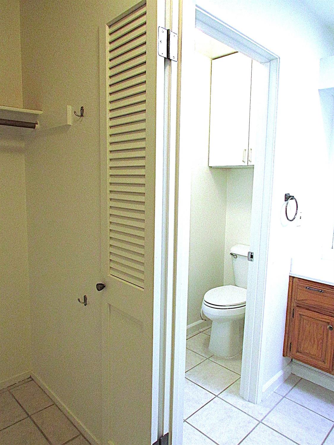 1855 Scenic Drive, Unit F Modesto, CA 95355 - Photo 48 of 52 a bathroom with a toilet and a shower