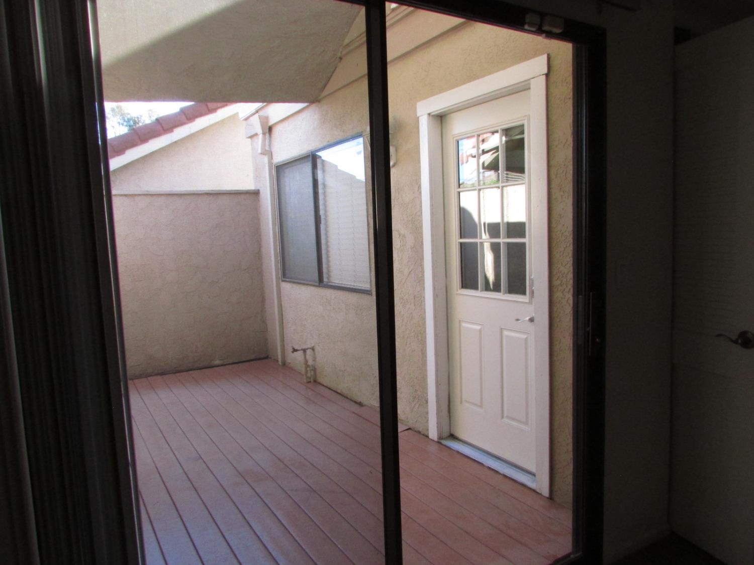 1855 Scenic Drive, Unit F Modesto, CA 95355 - Photo 51 of 52 a view of a hallway with wooden floor