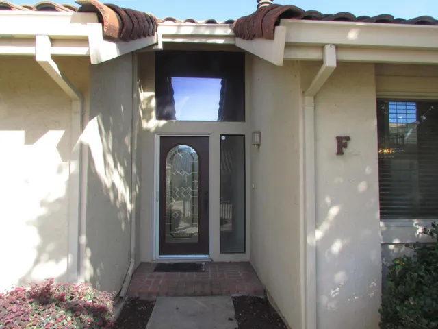 front view of a house with a garden