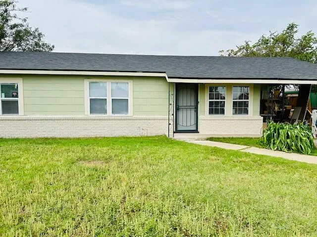 a view of a house with garden and yard