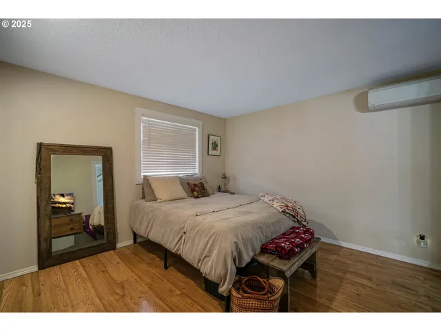 a bedroom with a bed and dresser
