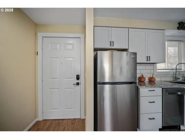a white refrigerator freezer sitting in a kitchen