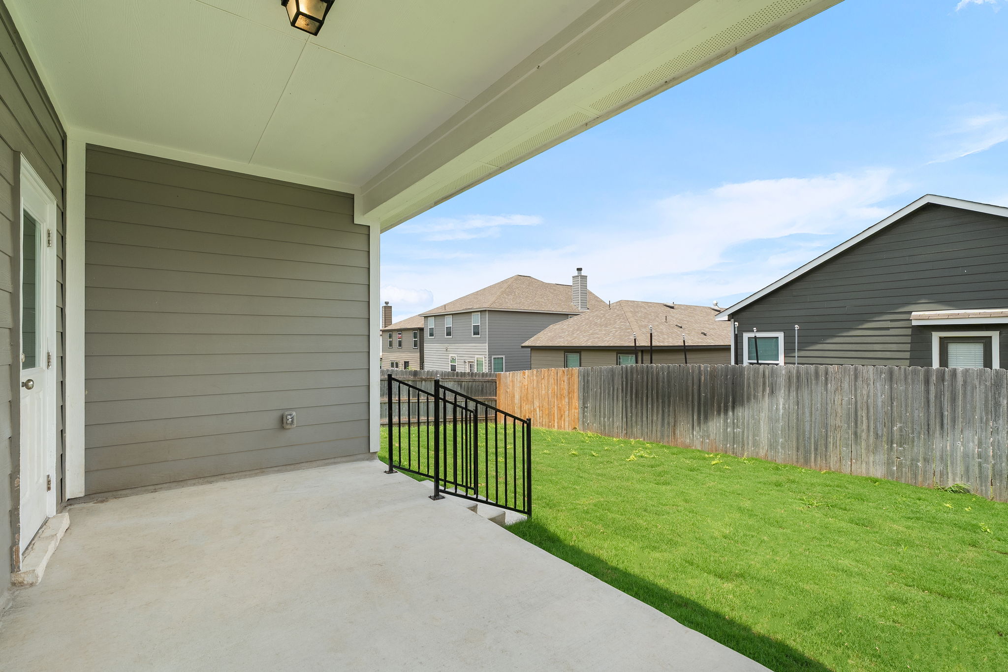 313 Mclintock Road Jarrell, TX 76537 - Photo 29 of 40 A spacious covered patio provides a delightful outdoor living area overlooking a fenced yard.