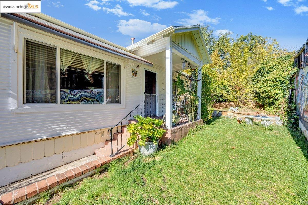 832 Shaws Flat Road Sonora, CA 95370 - Photo 1 of 22 a view of a house with backyard and porch