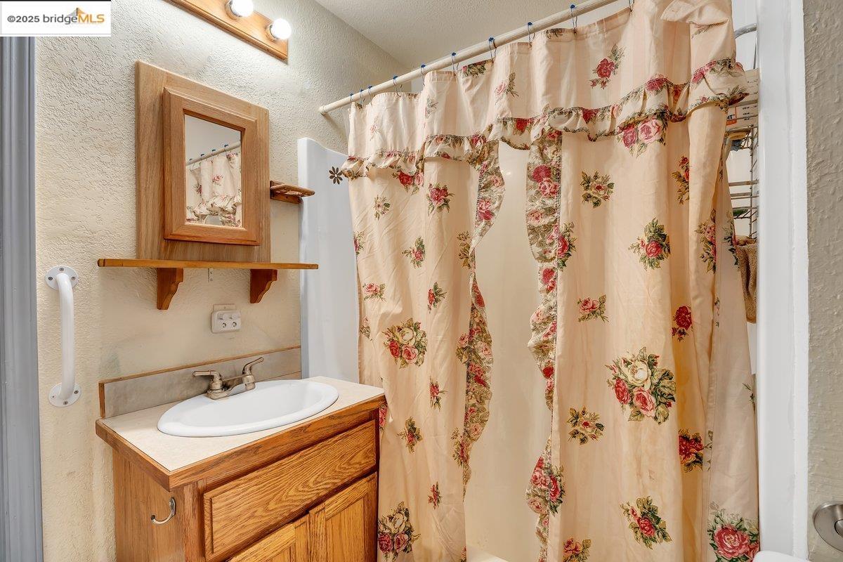 832 Shaws Flat Road Sonora, CA 95370 - Photo 12 of 22 a bathroom with a sink and a mirror