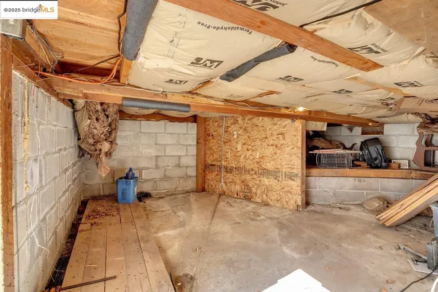 a view of a garage with rack and a white roof