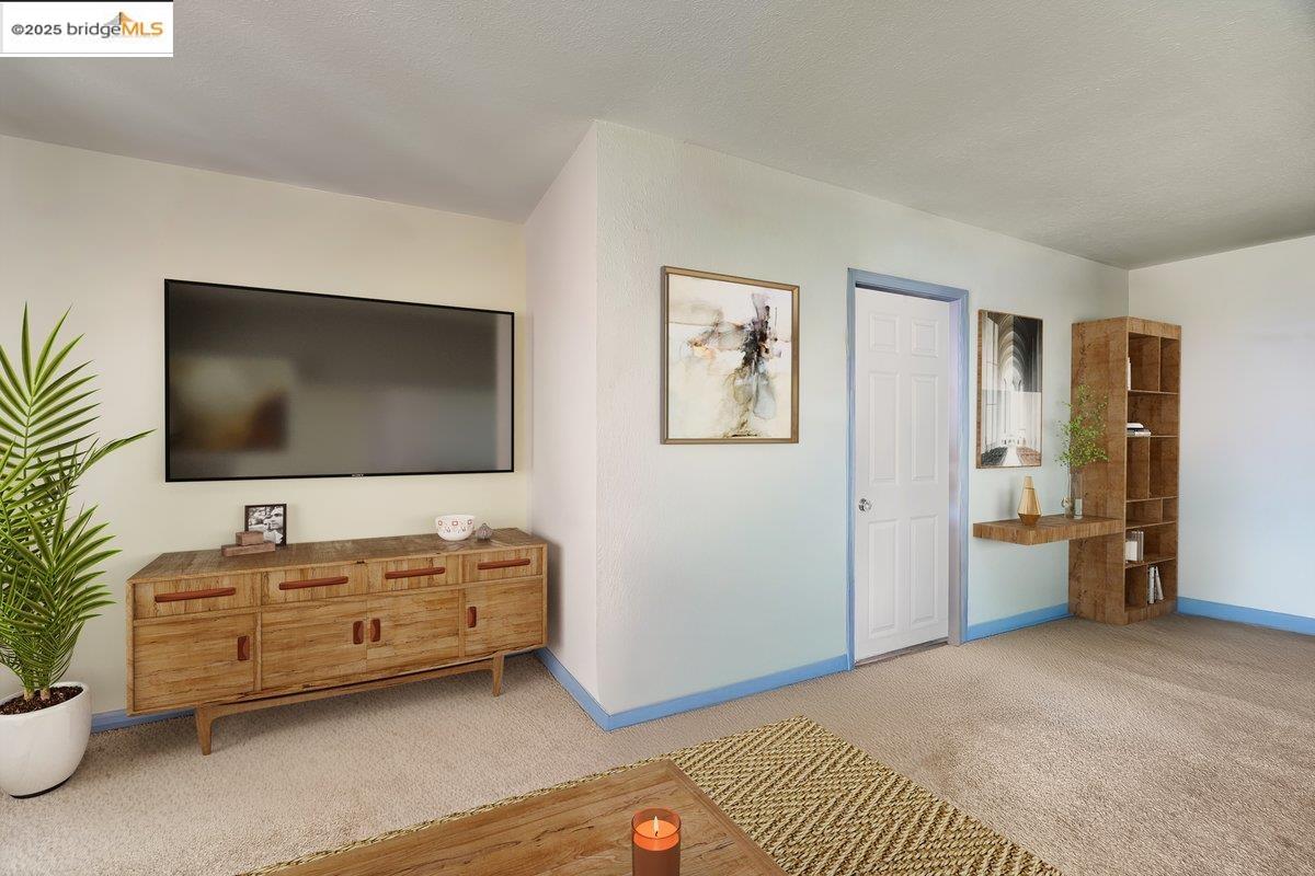 832 Shaws Flat Road Sonora, CA 95370 - Photo 8 of 22 a living room with furniture and a flat screen tv