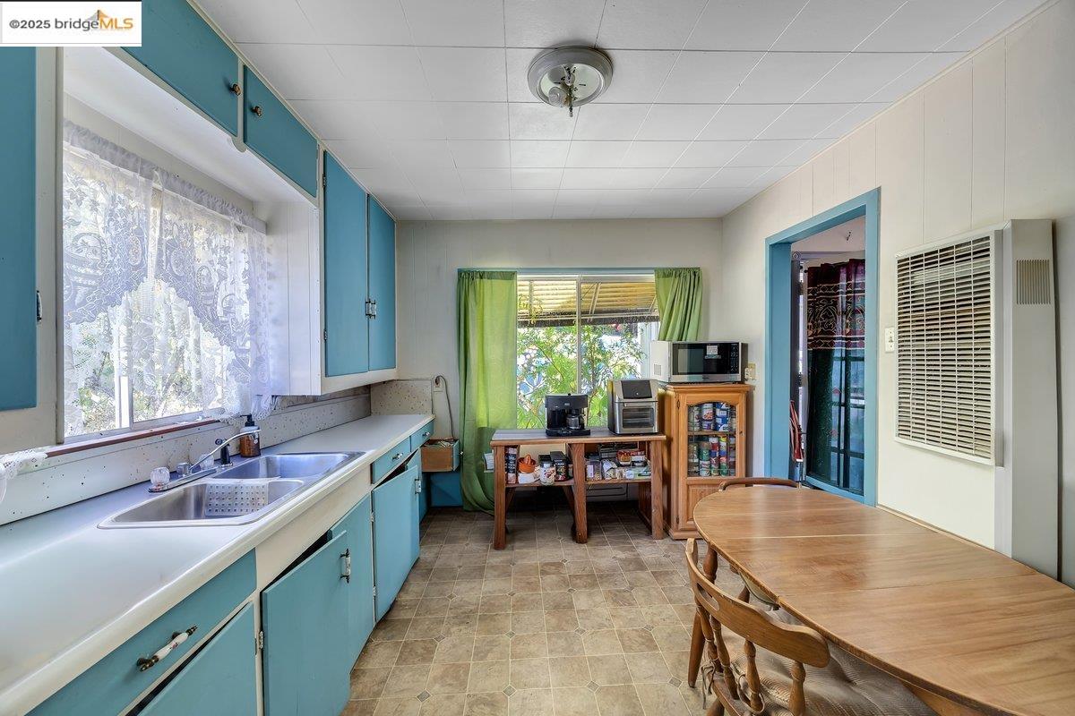 832 Shaws Flat Road Sonora, CA 95370 - Photo 9 of 22 a kitchen with furniture a sink appliances and a large window