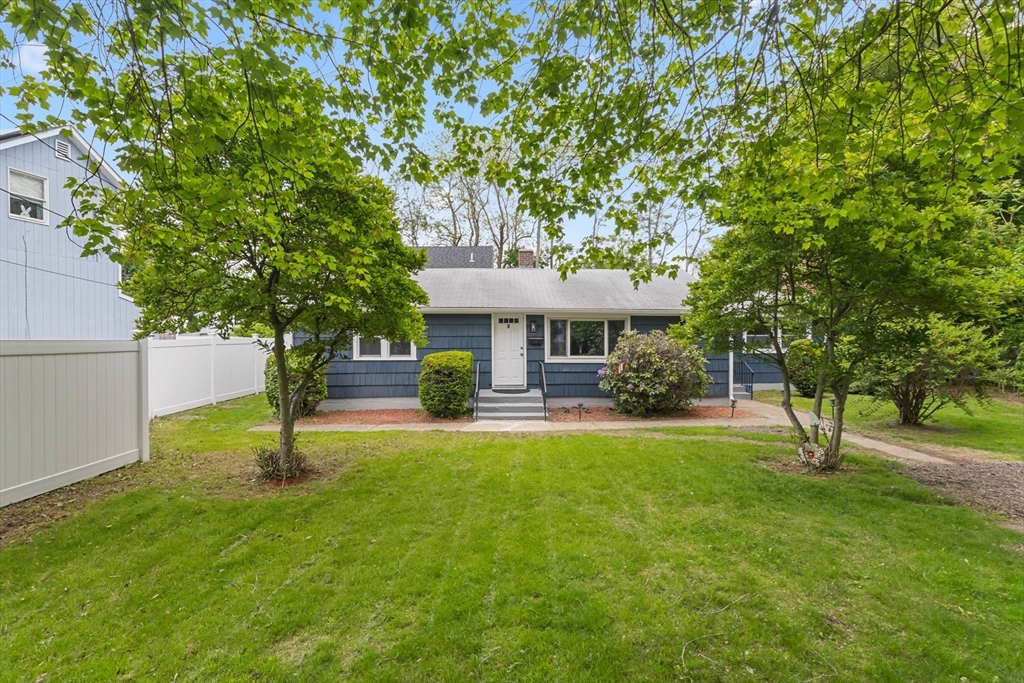a front view of a house with a yard