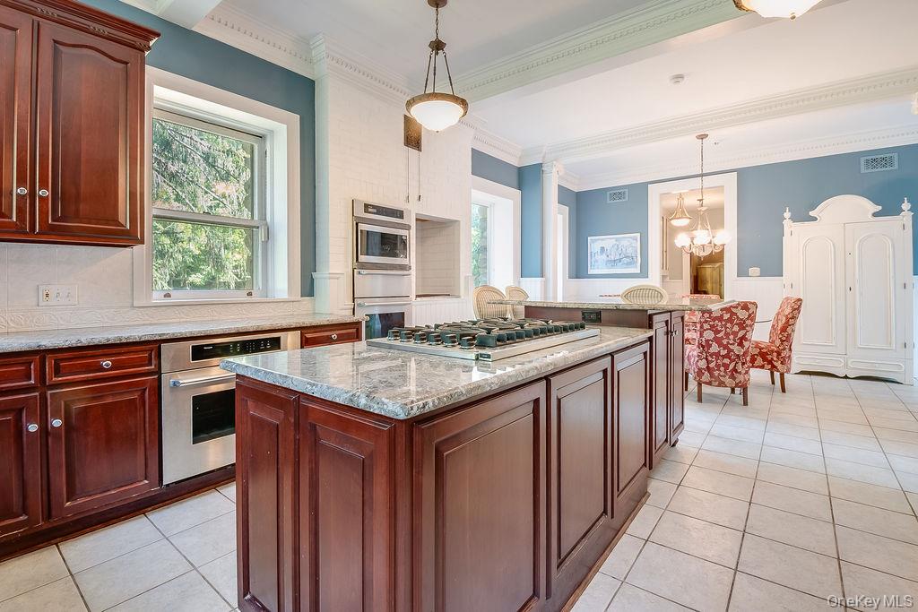 24 Jill Road Highland Mills, NY 10930 - Photo 17 of 43 a kitchen with granite countertop a sink stove and cabinets