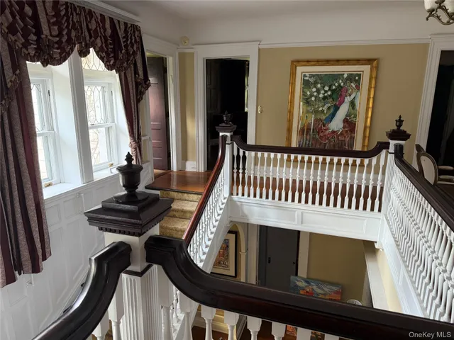 a view of a balcony with furniture and window