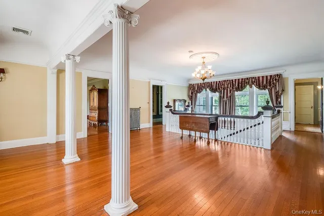 a view of a livingroom with wooden floor