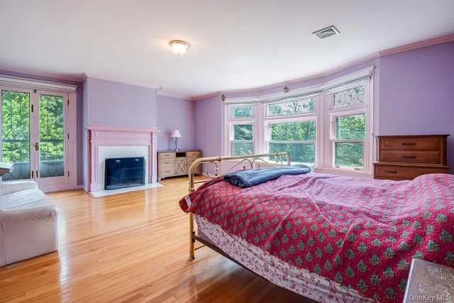 a bed room with a bed and a fireplace