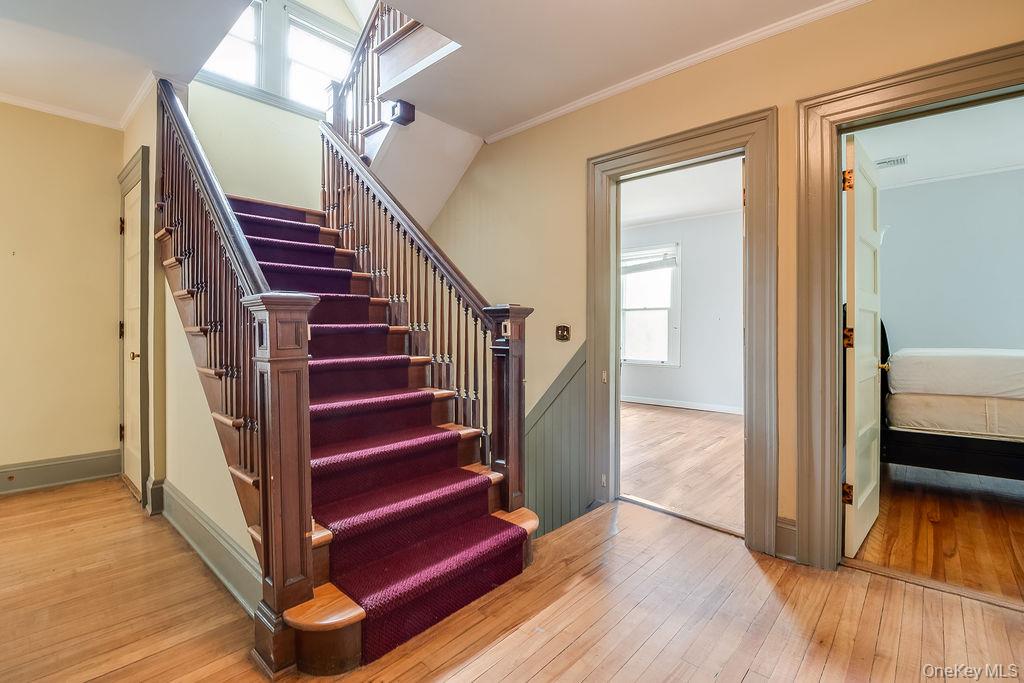 24 Jill Road Highland Mills, NY 10930 - Photo 30 of 43 a view of a hallway with wooden floor and stairs