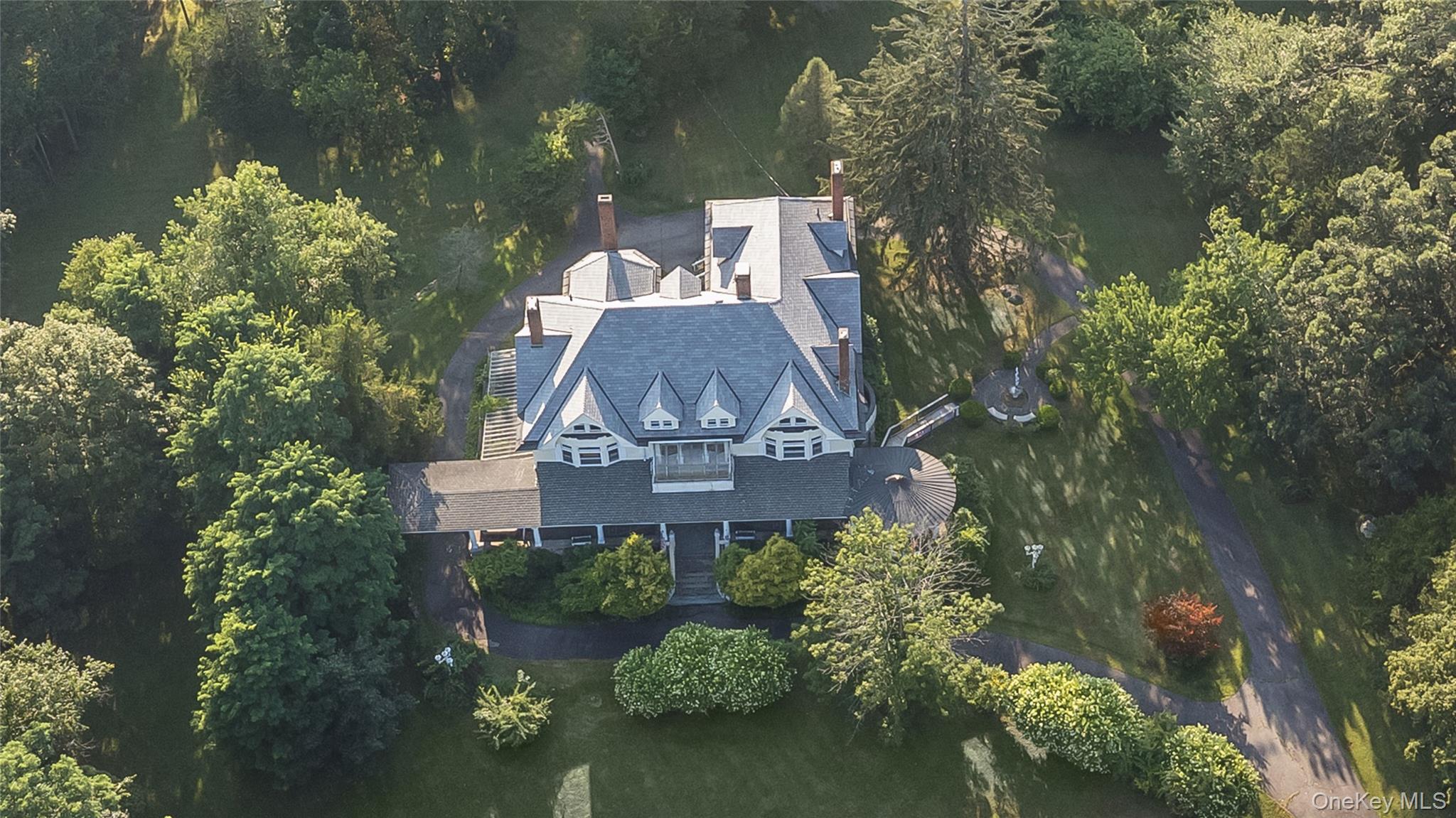 24 Jill Road Highland Mills, NY 10930 - Photo 34 of 43 an aerial view of a house with a yard lake and outdoor seating