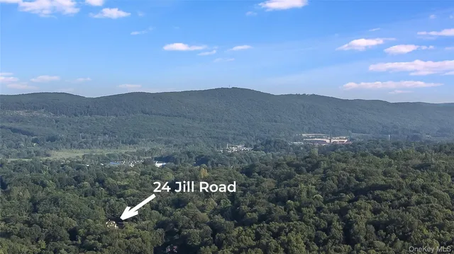 a view of houses with a street