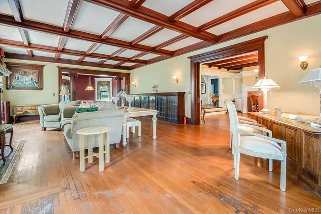 a view of a dining hall with furniture and wooden floor
